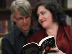 Out of focus couple reading The Hobbit